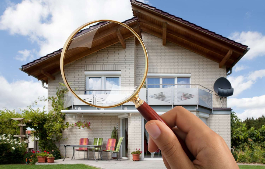 INSPECTION LOS ANGELES home inspection concept with magnifying glass focused on exterior