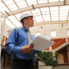 INSPECTION LOS ANGELES commercial property inspector reviewing report indoors