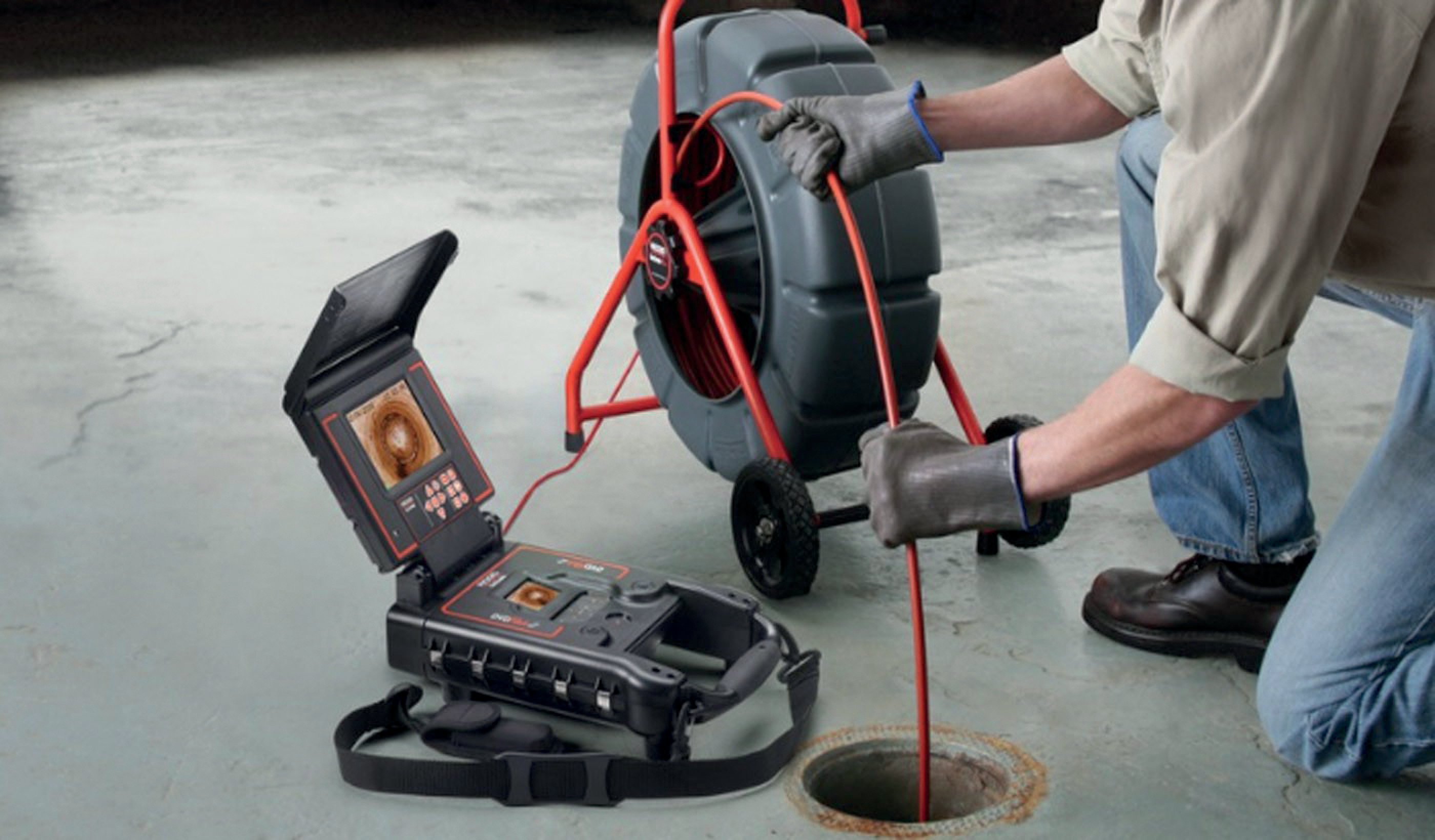 Sewer camera inspection in progress using digital pipe scope and display equipment