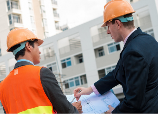 INSPECTION LOS ANGELES commercial inspectors reviewing building blueprints on site