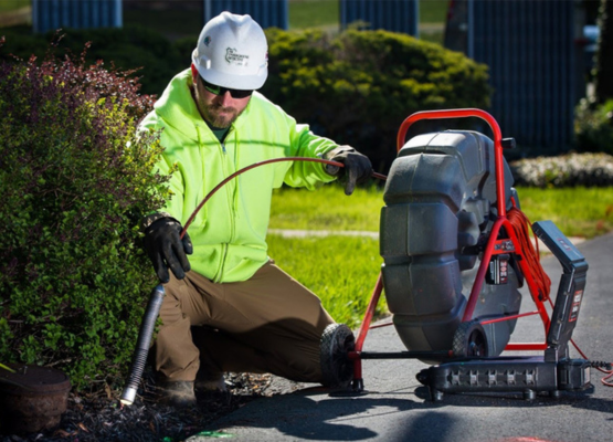 INSPECTION LOS ANGELES conducting sewer line inspection with camera equipment